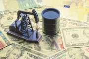 Petroleum, petrodollar and crude oil concept : Pump jack and a black barrel on US USD dollar notes, depicts the money received or earned from sales after investment in the development of oil industry.
