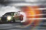 Car drifting, Sport car wheel drifting and smoking on blurred background.