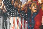 Excited fans in sports crowd, celebrating and cheering on team success. Group of American soccer fans celebrating victory.