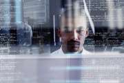 Cropped shot of a young computer programmer looking through data