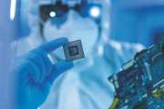 Professional African-American scientist works in a modern scientific laboratory for the research and development of microelectronics and processors. Microprocessor manufacturing worker uses computer technology and equipment.