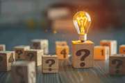 A lightbulb illuminates a question mark block, symbolizing the power of knowledge and finding solutions.