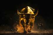 Powerful golden bull charging forward, concept the stock market's financial upward trend.