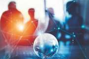 Business World concept with glass Earth on a desk