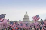 Presidential Inauguration 2013 .  Flag waving spectators throng the Washington Mall near the capital.