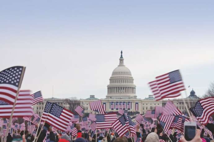 Presidential Inauguration 2013 .  Flag waving spectators throng the Washington Mall near the capital.