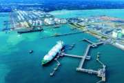 LNG (Liquified Natural Gas) tanker anchored in Gas terminal gas tanks for storage. Oil Crude Gas Tanker Ship. LPG at Tanker Bay Petroleum Chemical or Methane freighter export import transportation and logistics
