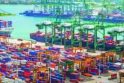Aerial panorama of cargo ships in Singapore industrial port harbor by pier with freight cranes and goods containers, seacsape at background