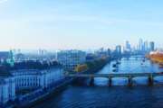 Iconic London skyline with London Eye in morning light over the Thames