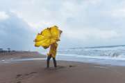 Man on stormy beach