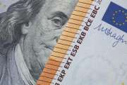 Benjamin Franklin peeking through euro banknotes