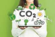 Reduce CO2 with woman holding a tablet computer