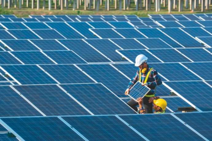 Team electrician installing solar panels working on alternative energy sources clean,Green environment friendly energy modern technology.