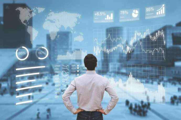 Person analyzing a financial dashboard with key performance indicators (KPI) and business intelligence (BI) charts with a business district cityscape in background