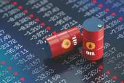 Oil drums sitting over a trading board which shows a stock market crash. Selective focus. Horizontal composition with copy space. Global business instability concept.
