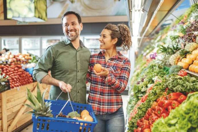 Shopping fresh groceries in modern supermarket in Latin America