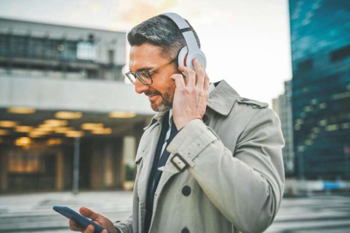 Catching up with podcasts during his morning commute