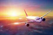 Airplane in the sky at sunset