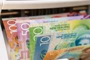 New Zealand dollar in a money counter. Financial and business concept. All banknotes. Banking, economics, investing in New Zealand