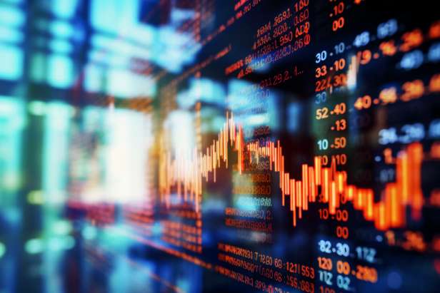 Close-up of a digital screen displaying financial stock market data with graphs and analytics, illustrating market trends and investment analysis.