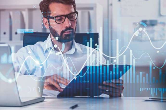 Businessman or stock trader analyzing stock graph chart by fibonacci indicator, side view business woman using laptop to buy or sell stock, double exposure graph, internet trading